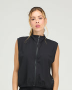 Chaleco deportivo negro de cuello alto con cremallera frontal y hombros amplios para mujer en Shopify Colombia.