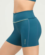 Short deportivo tipo ciclista azul petróleo para mujer de tiro alto y silueta ajustada St. Even.