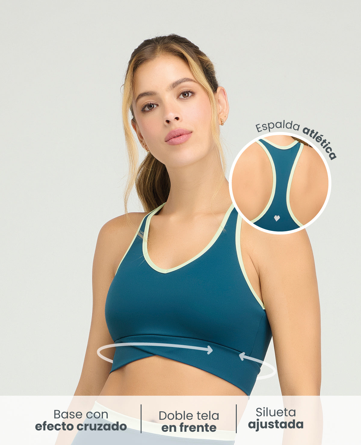 Top deportivo azul con silueta ajustada, base cruzada y espalda atlética para mujer St. Even.