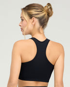 Espalda atlética de top deportivo negro seamless sin costuras para mujer St. Even con ajuste perfecto.