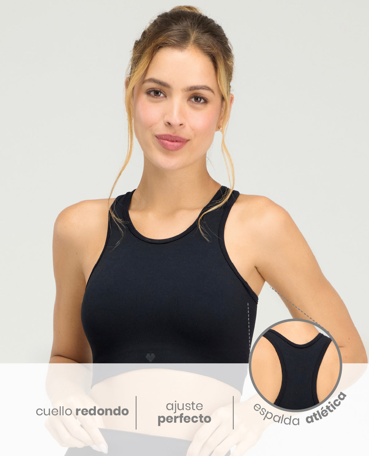 Top deportivo negro sin costuras para mujer con cuello redondo y detalle de espalda atlética en tecnología seamless.