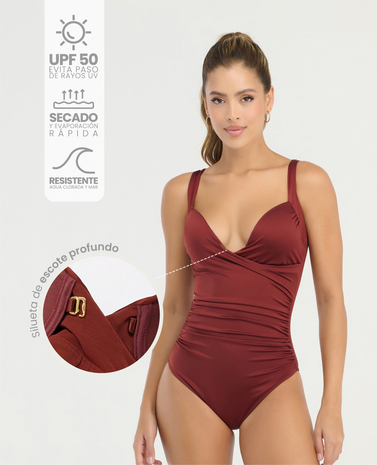 Vestido de baño entero color vino con escote cruzado profundo, control de abdomen y efecto drapeado lateral.